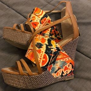 Size 9 1/2 wedge shoes. Worn 2-3 times. Colorful.